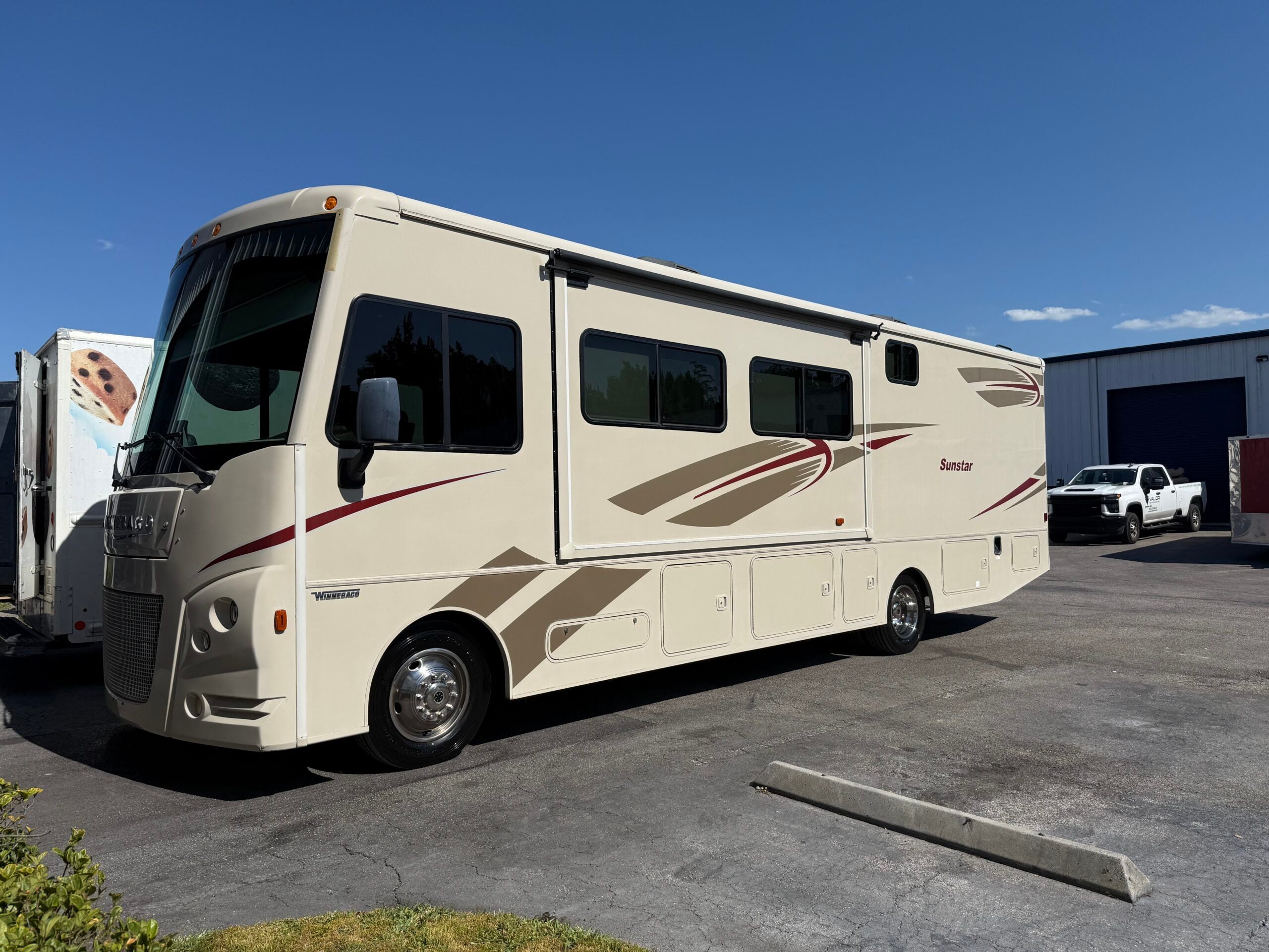 Newer RV with a deep gloss ceramic coating finish in Florida sunlight